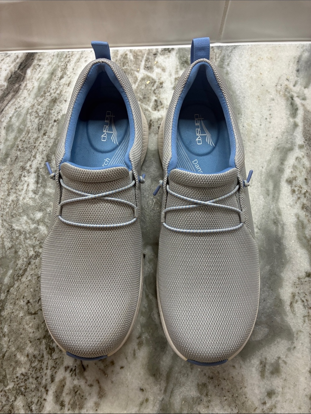 Skechers Men’s Slip-On Sneakers in Light Gray with Blue Lining by Dansko.